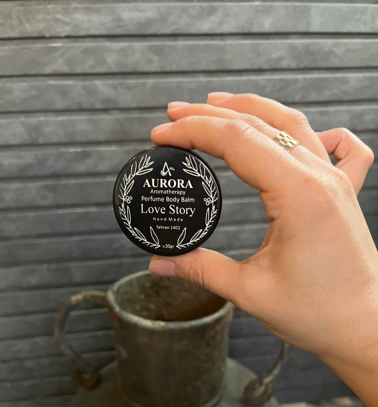 عطر جامد (بالم عطری) آرورا با رایحه لاو استوری