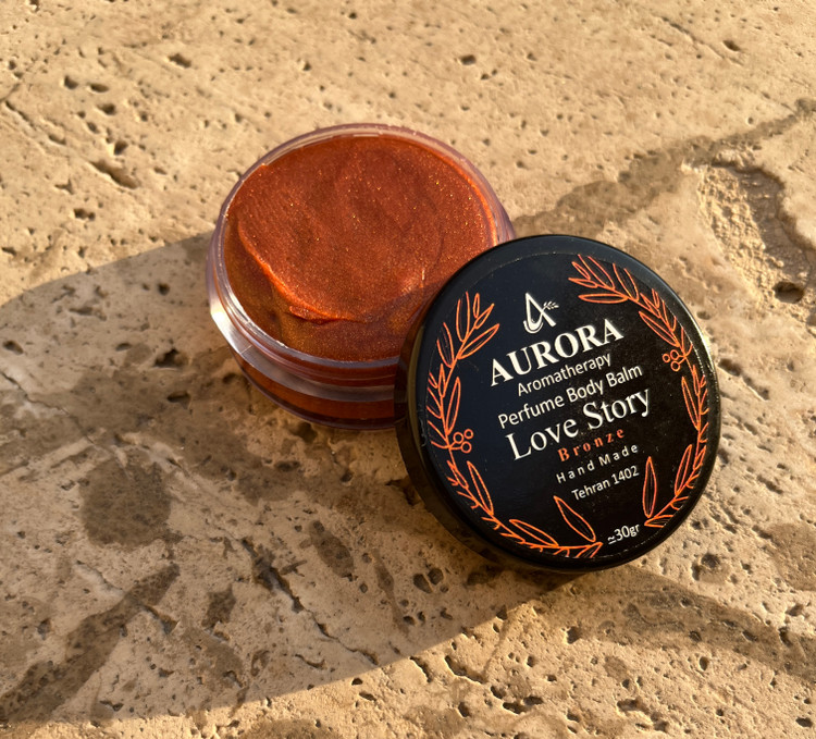 عطر جامد (بالم عطری) آرورا با رایحه لاو استوری برنز
